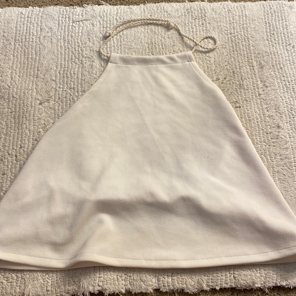 White top. Ties at the tops very elegant